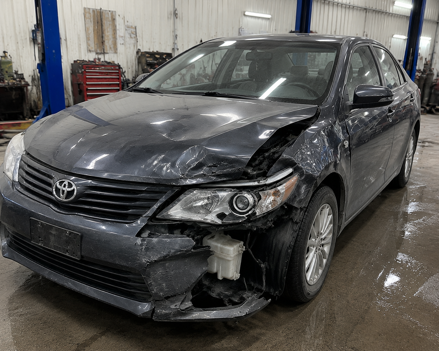 Damaged car prepared for professional scrap vehicle recovery in UAE